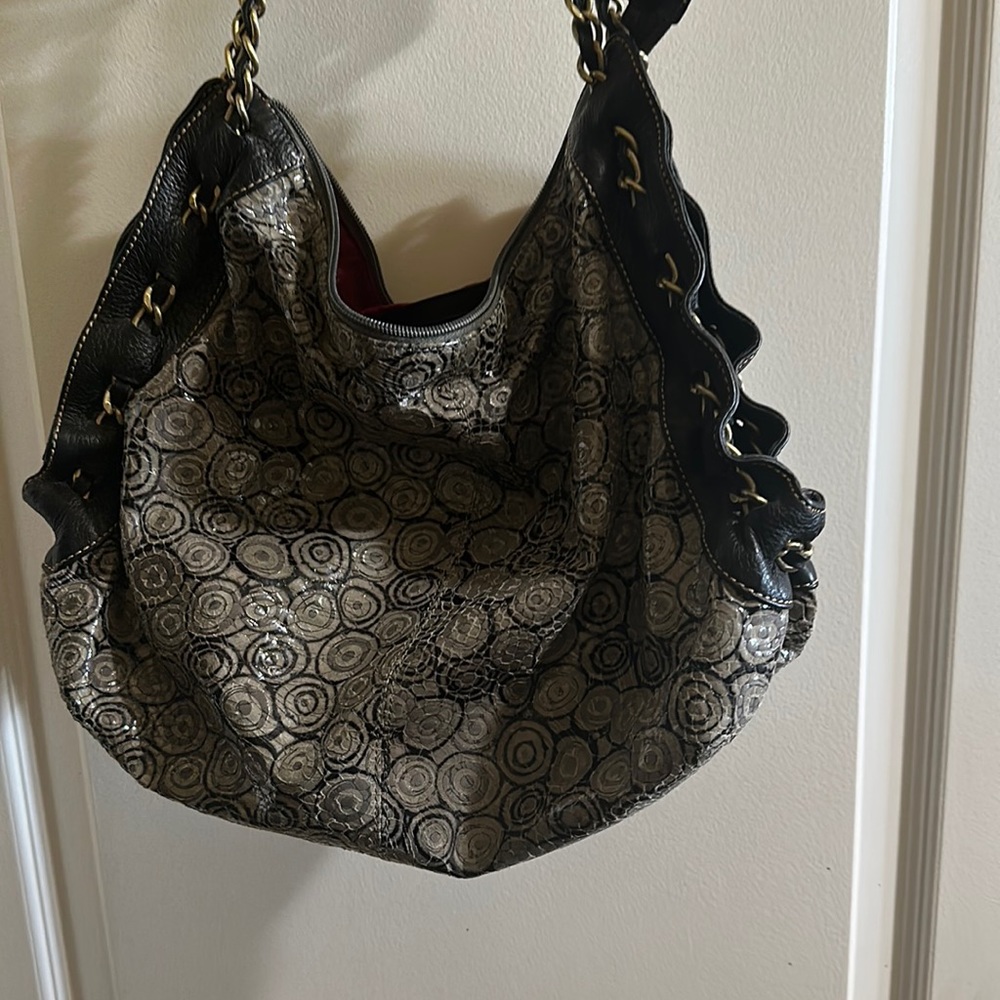 Sharif silver and sparkling black purse with red lining